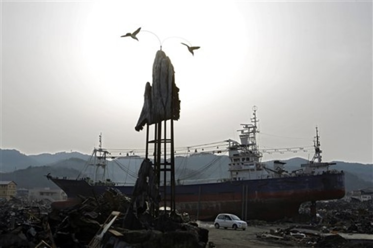 The day after tomorrow? A grounded ship is perched amid tsunami debris in the port town of Kesennuma, Miyagi prefecture, Japan, on April 11.